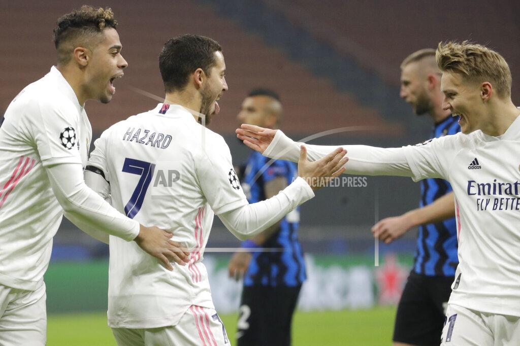 Luca Bruno Real Madrid's Eden Hazard, center, celebrates with teammates after scoring during the Group B, Champions League soccer match between Inter Milan and Real Madrid at the San Siro Stadium, in Milan, Italy, Wednesday, Nov. 25, 2020. (AP Photo/Luca Bruno)