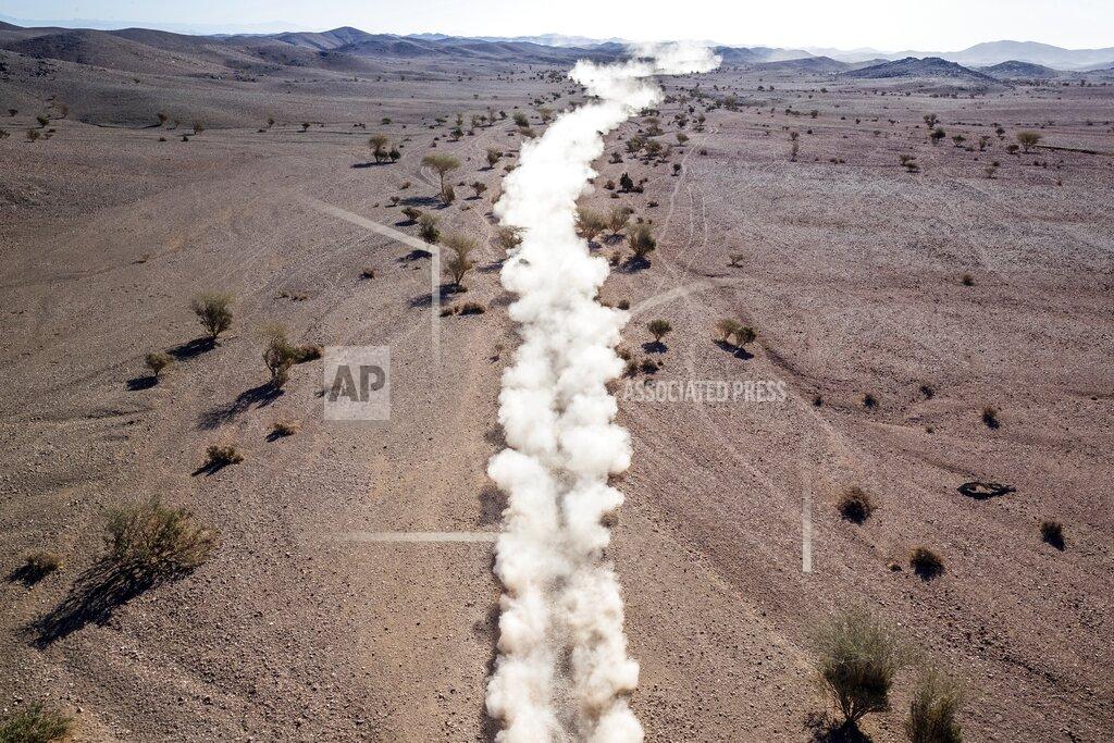 Bernat Armangue A tail of dust from a race car is seen during stage two of the Dakar Rally, between Al Wajh and Neom, Saudi Arabia, Monday, Jan. 6, 2020. (AP Photo/Bernat Armangue)