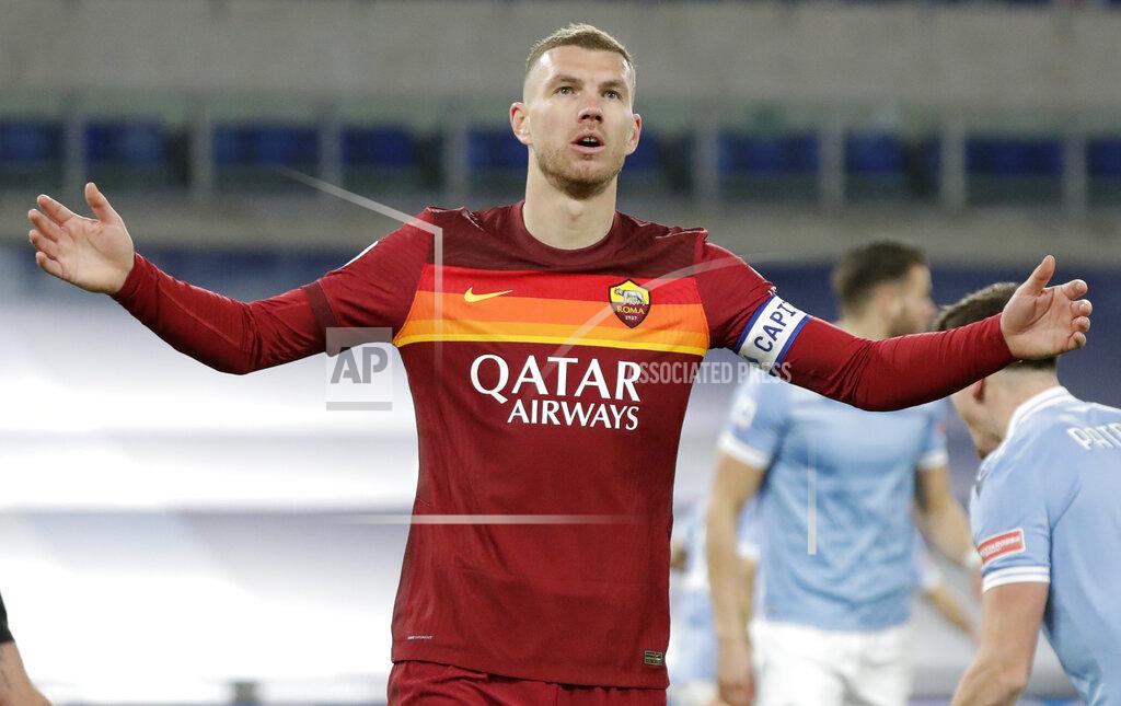 Andrew Medichini Roma's Edin Dzeko after missing a chance during the Serie A soccer match between Lazio and Roma, at Rome's Olympic Stadium, Friday, Jan. 15, 2021. (AP Photo/Andrew Medichini)