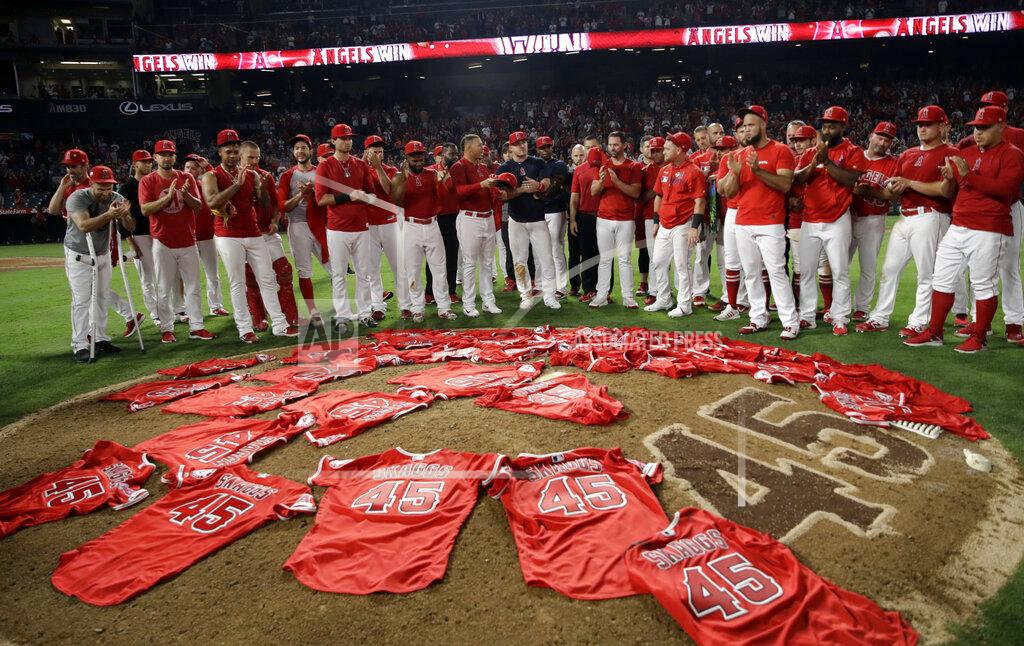 Marcio Jose Sanchez Members of the Los Angeles Angels place their jerseys with No. 45 in honor of pitcher Tyler Skaggs on the mound after a combined no-hitter against the Seattle Mariners during a baseball game, July 12, 2019, in Anaheim, Calif. (AP Photo/Marcio Jose Sanchez)
