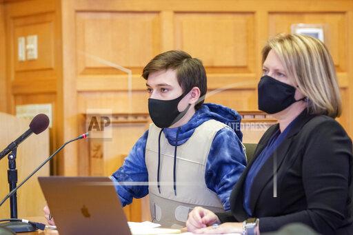 Willard Noble Chaiden Miller and his attorney Christine Branstad attend a bond review hearing at the Jefferson County Courthouse in Fairfield, Iowa, Tuesday, Nov. 23, 2021. Jeremy Everett Goodale and Willard Noble Chaiden Miller, two southeast Iowa teenagers charged with first-degree murder and conspiracy to commit murder in the death of their high school Spanish teacher, asked a state court judge Tuesday to lower their bond so they could be released from jail, while prosecutors asked it be maintained at $1 million or even raised to $2 million. (Zach Boyden-Holmes/The Des Moines Register via AP)