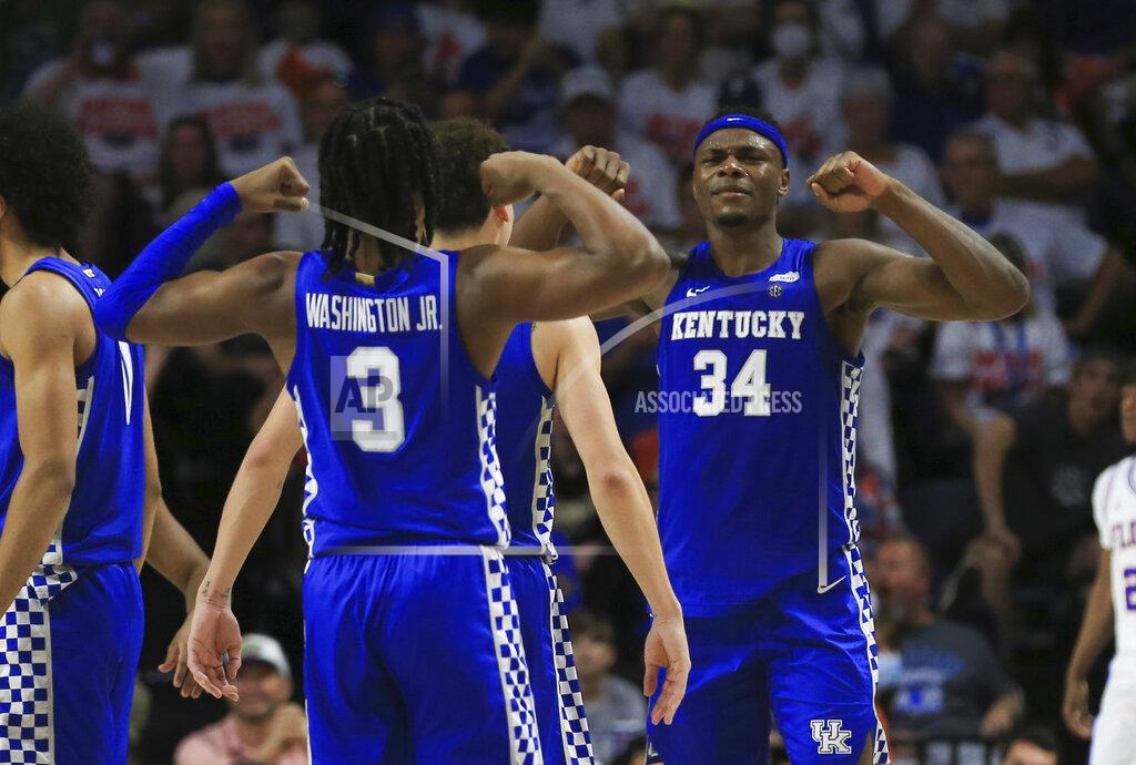 Matt Stamey Kentucky forward Oscar Tshiebwe (34) and guard TyTy Washington Jr. (3) celebrate after a play against Florida during the second half of an NCAA college basketball game Saturday, March 5, 2022, in Gainesville, Fla. (AP Photo/Matt Stamey)