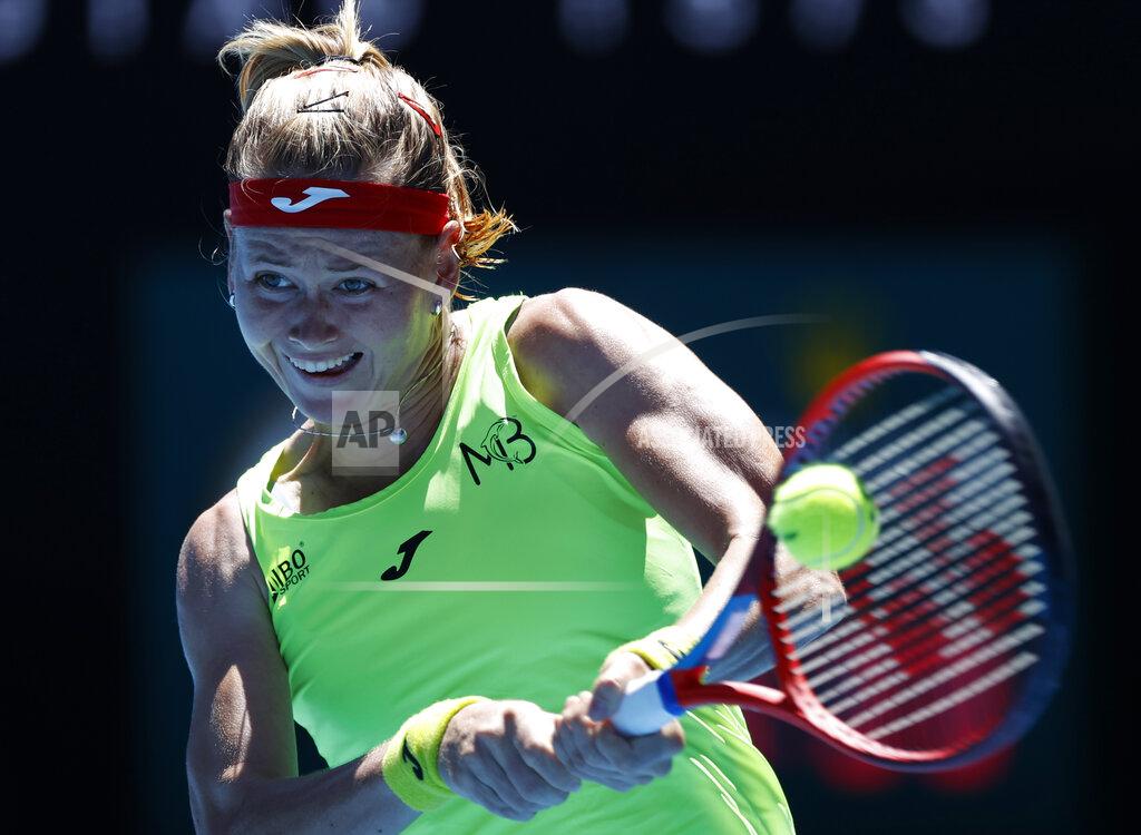 Rick Rycroft Marie Bouzkova of the Czech Republic makes a backhand return to Ukraine's Elina Svitolina during their first round match at the Australian Open tennis championship in Melbourne, Australia, Tuesday, Feb. 9, 2021.(AP Photo/Rick Rycroft)