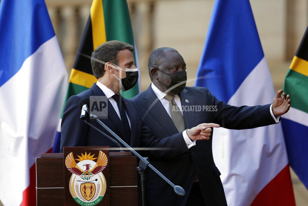 Themba Hadebe South African President Cyril Ramaphosa, right, and his French counterpart Emmanuel Macron speak during a press conference at the government's Union Building, in Pretoria, South Africa, Friday, May 28, 2021. Macron is on a two-day official visit to the country. (AP Photo/Themba Hadebe, Pool)