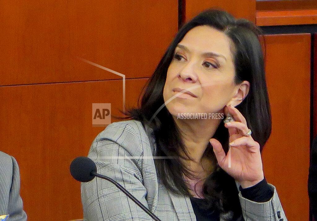 Uncredited FILE - This undated file photo provided by the Rutgers Law School shows U.S. District Judge Esther Salas during a conference at the Rutgers Law School in Newark, N.J. On Sunday, July 19, 2020, a gunman posing as a FedEx delivery person went to Salas' North Brunswick, N.J., home and started shooting, wounding her husband, the defense lawyer Mark Anderl, and killing her son, Daniel Anderl. (Rutgers Law School via AP, File)