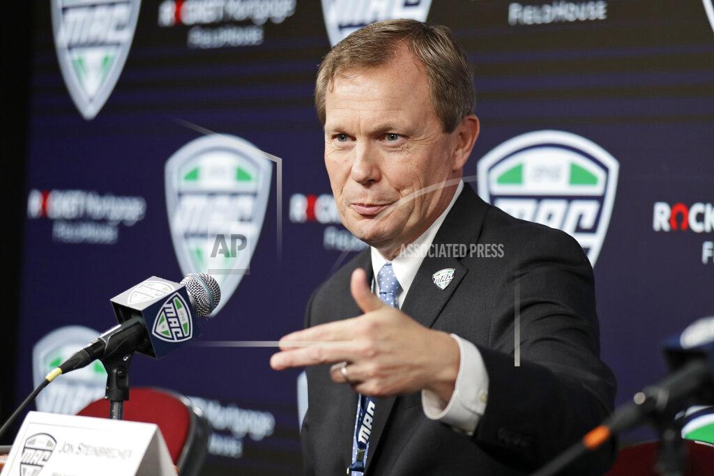 Tony Dejak d FILE - In this March 12, 2020, file photo, Mid-American Conference commissioner Jon Steinbrecher speaks during an NCAA college football news conference in Cleveland. The Mid-American Conference announced Friday, Sept. 25, 2020, that it will have a 6-game football season, meaning all 10 major conferences will play this fall. (AP Photo/Tony Dejak, File)