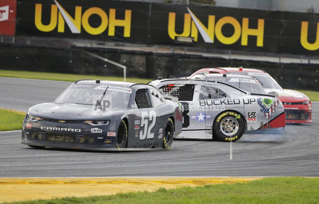 Terry Renna Kody Vanderwal (52) goes by as Joe Graf Jr. (08) spins in the infield during the NASCAR Xfinity series auto race at Daytona International Speedway, Saturday, Aug. 15, 2020, in Daytona Beach, Fla. (AP Photo/Terry Renna)
