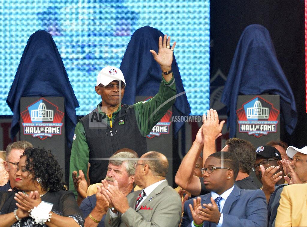 David Richard FILE - In this Aug. 2, 2014, file photo, Gale Sayers is introduced during the Pro Football Hall of Fame enshrinement ceremony in Canton, Ohio. Six Hall of Famers and 230 past and present players and coaches were on hand as the Bears kicked off their 100th anniversary celebration weekend on Friday, June 7, 2019. And when Sayers was wheeled onto the stage, the roar from the crowd could have drowned out the jets nearby at O’Hare International Airport. Weakened by dementia diagnosed five years ago, Sayers still made the 130-mile trip from his home in Wakarusa, Ind. (AP Photo/David Richard, File)