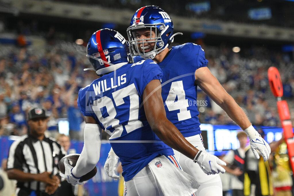 Corey Sipkin New York Giants wide receiver Damion Willis (87) celebrates his touchdown with running back Sandro Platzgummer (34) in the second half of an NFL preseason football game against the New York Jets, Saturday, Aug. 14, 2021, in East Rutherford, N.J. (AP Photo/Corey Sipkin)