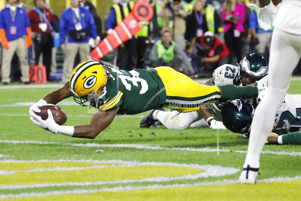 Jeffrey Phelps Green Bay Packers running back Aaron Jones dives into the end zone for a touchdown during the first half of the team's NFL football game against the Philadelphia Eagles on Thursday, Sept. 26, 2019, in Green Bay, Wis. (AP Photo/Jeffrey Phelps)