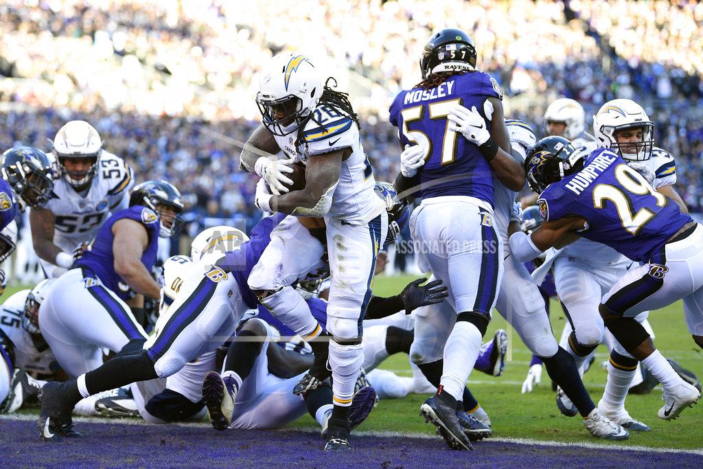 Nick Wass Los Angeles Chargers running back Melvin Gordon (28) scores a touchdown in the second half of an NFL wild card playoff football game against the Baltimore Ravens, Sunday, Jan. 6, 2019, in Baltimore. (AP Photo/Nick Wass)