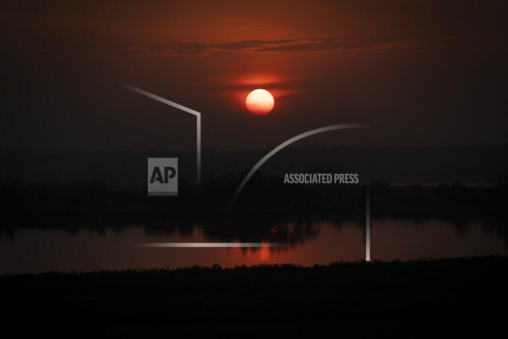 Uncredited The sun sets over Murchison Falls National Park, northwest Uganda, on Feb. 21, 2020. The East Africa Crude Oil Pipeline, a controversial oil project that would connect oilfields in the park to a port in Tanzania is in breach of global environmental and human rights guidelines for banks, according to a new report by Inclusive Development International on Tuesday, July 5. (AP Photo)