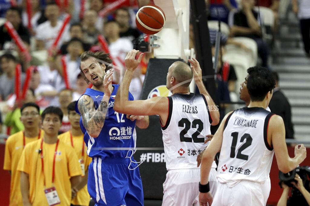 Ng Han Guan Czech Republic's Ondrej Balvin, left reacts near Japan's Nick Fazekas, center and Japan's Yuta Watanabe at right during a Group E match for the FIBA Basketball World Cup at the Shanghai Oriental Sports Center in Shanghai on Tuesday, Sept. 3, 2019. (AP Photo/Ng Han Guan)