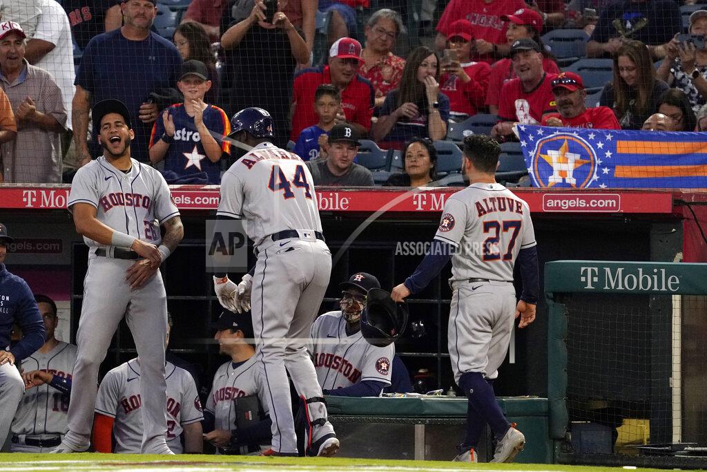 Mark J. Terrill Houston Astros' Yordan Alvarez, center, celebrates with Jose Siri, left, and Jose Altuve after hitting a two-run home run during the first inning of a baseball game against the Los Angeles Angels Wednesday, Sept. 22, 2021, in Anaheim, Calif. (AP Photo/Mark J. Terrill)