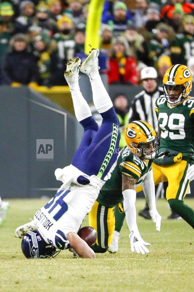 Matt Ludtke Seattle Seahawks' Jacob Hollister fumbles as he is hit by Green Bay Packers' Jaire Alexander during the first half of an NFL divisional playoff football game Sunday, Jan. 12, 2020, in Green Bay, Wis. (AP Photo/Matt Ludtke)