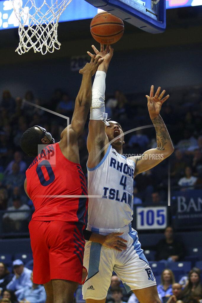 Stew Milne Rhode Island's Tyrese Martin (4) is fouled by Dayton's Rodney Chatman (0) during the second half of an NCAA college basketball game Wednesday, March 4, 2020, in Kingston, R.I. (AP Photo/Stew Milne)