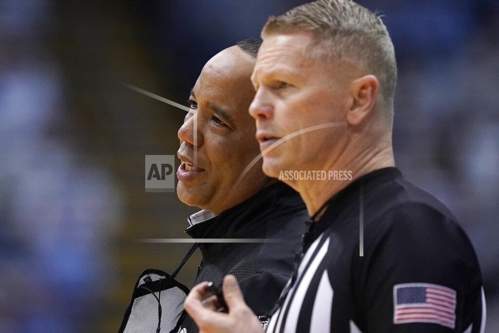 Gerry Broome North Carolina State head coach Kevin Keatts, left, speaks with an official during the second half of an NCAA college basketball game against North Carolina in Chapel Hill, N.C., Saturday, Jan. 29, 2022. (AP Photo/Gerry Broome)