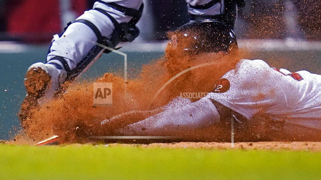 Charles Krupa Boston Red Sox's Alex Verdugo gets a face full of dirt while sliding home safely on a single by Trevor Story during the sixth inning of the team's baseball game against the Seattle Mariners at Fenway Park, Thursday, May 19, 2022, in Boston. (AP Photo/Charles Krupa)