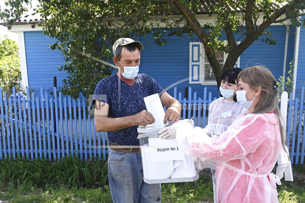Uncredited A man casts his ballot at his house in Starozolotovsky village, 160 km (100 miles) north of Rostov-on-Don during the Parliamentary elections , Russia, Saturday, Sept. 18, 2021. Sunday is the last of three days voting for a new parliament, but there seems to be no expectation that United Russia, the party devoted to President Vladimir Putin, will lose its dominance in the State Duma. (AP Photo)
