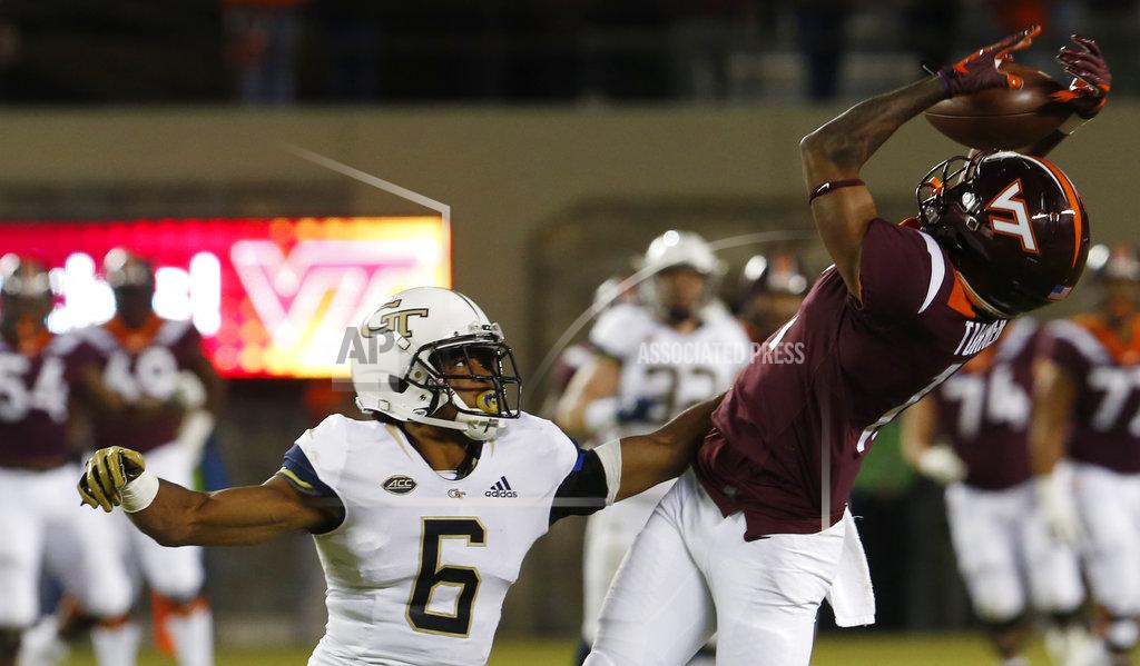 Steve Helber Virginia Tech wide receiver Tre Turner, right, misses a catch on fourth down as Georgia Tech defensive back Lamont Simmons (6) defends during the second half of an NCAA college football game in Blacksburg, Va., Thursday, Oct. 25, 2018. (AP Photo/Steve Helber)