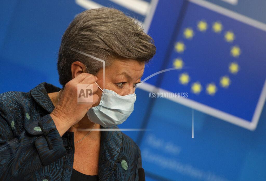 Virginia Mayo European Commissioner for Home Affairs Ylva Johansson takes off her protective face mask as she prepares to address a media conference after a meeting of EU interior ministers at the European Council building in Brussels, Friday, Nov. 13, 2020. (AP Photo/Virginia Mayo, Pool)