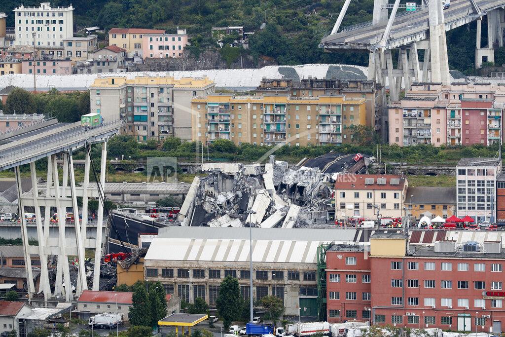 Antonio Calanni FILE - Cars are blocked on the Morandi highway bridge after a section of it collapsed, in Genoa, northern Italy, on Aug. 14, 2018. Fifty-nine people went on trial Thursday, July 7, 2022, for the 2018 collapse of Genoa’s Morandi bridge, accused of manslaughter and other charges in the deaths of 43 people.The defendants include former executives and experts of the company that manages many of Italy’s bridges and highways, as well as former officials of the transport and infrastructure ministry. (AP Photo/Antonio Calanni)
