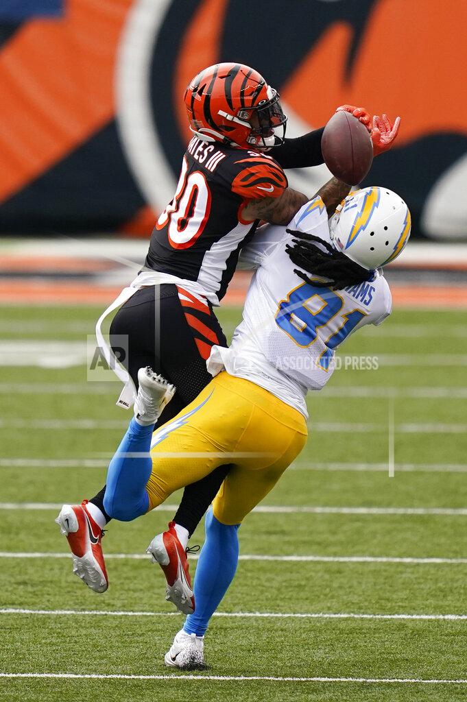 Bryan Woolston Cincinnati Bengals' Jessie Bates (30) breaks up a pass intended by Los Angeles Chargers' Mike Williams (81) during the second half of an NFL football game, Sunday, Sept. 13, 2020, in Cincinnati. (AP Photo/Bryan Woolston)