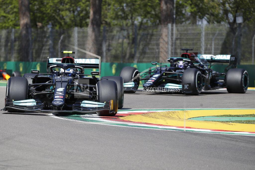 Luca Bruno Mercedes driver Valtteri Bottas of Finland is followed by Mercedes driver Lewis Hamilton of Britain during free practice for Sunday's Emilia Romagna Formula One Grand Prix, at the Imola track, Italy, Friday, April 16, 2021. (AP Photo/Luca Bruno)