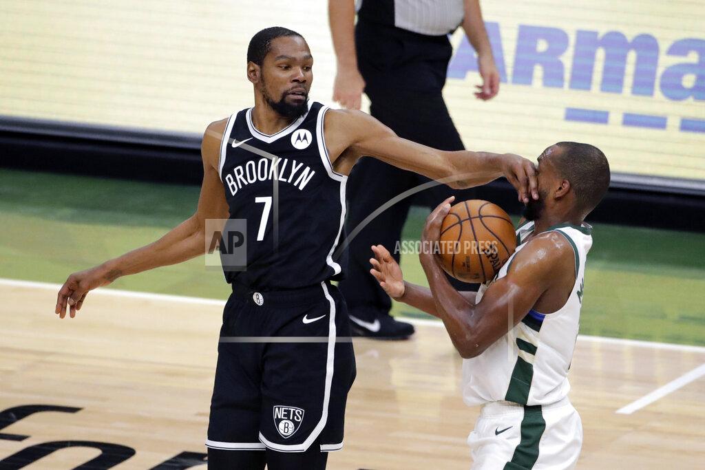 Aaron Gash Milwaukee Bucks' Khris Middleton, right, steals the ball from Brooklyn Nets' Kevin Durant (7) during the second half of an NBA basketball game Tuesday, May 4, 2021, in Milwaukee. (AP Photo/Aaron Gash)