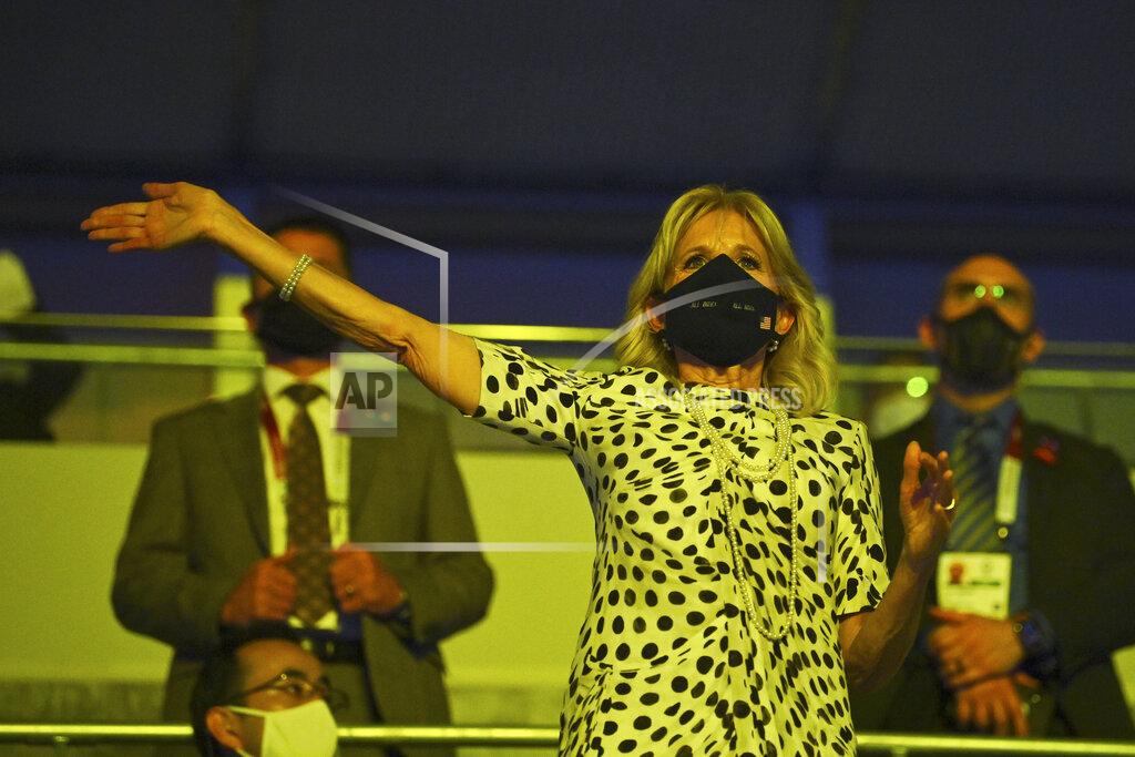 Dylan Martinez First lady of the United States Jill Biden waves during the opening ceremony in the Olympic Stadium at the 2020 Summer Olympics, Friday, July 23, 2021, in Tokyo, Japan. (Dylan Martinez/Pool Photo via AP)
