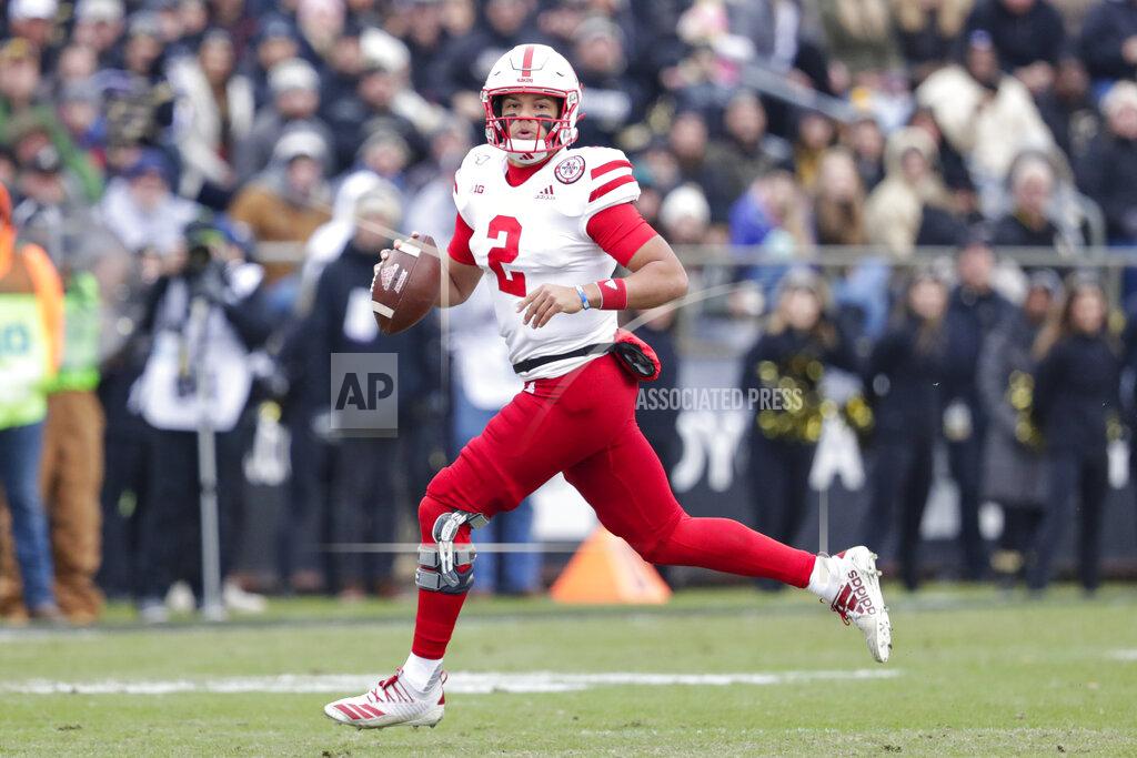 Michael Conroy Nebraska quarterback Adrian Martinez (2) looks for a receiver as he scrambles against Purdue during the first half of an NCAA college football game in West Lafayette, Ind., Saturday, Nov. 2, 2019. (AP Photo/Michael Conroy)