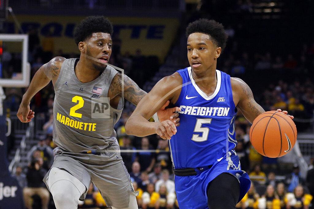 Aaron Gash Creighton's Ty-Shon Alexander (5) drives to the basket against Marquette's Sacar Anim (2) during the second half of an NCAA college basketball game Tuesday, Feb. 18, 2020, in Milwaukee. (AP Photo/Aaron Gash)