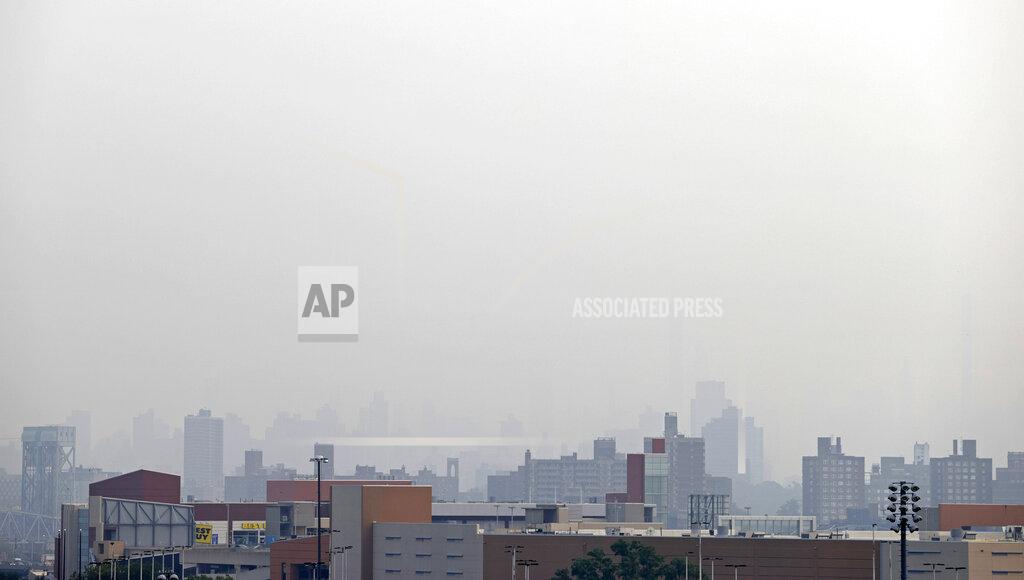 Adam Hunger Smoke blocks the view looking toward Manhattan from Yankee Stadium before the Philadelphia Phillies played the New York Yankees in a baseball game Tuesday, July 20, 2021, in New York. (AP Photo/Adam Hunger)