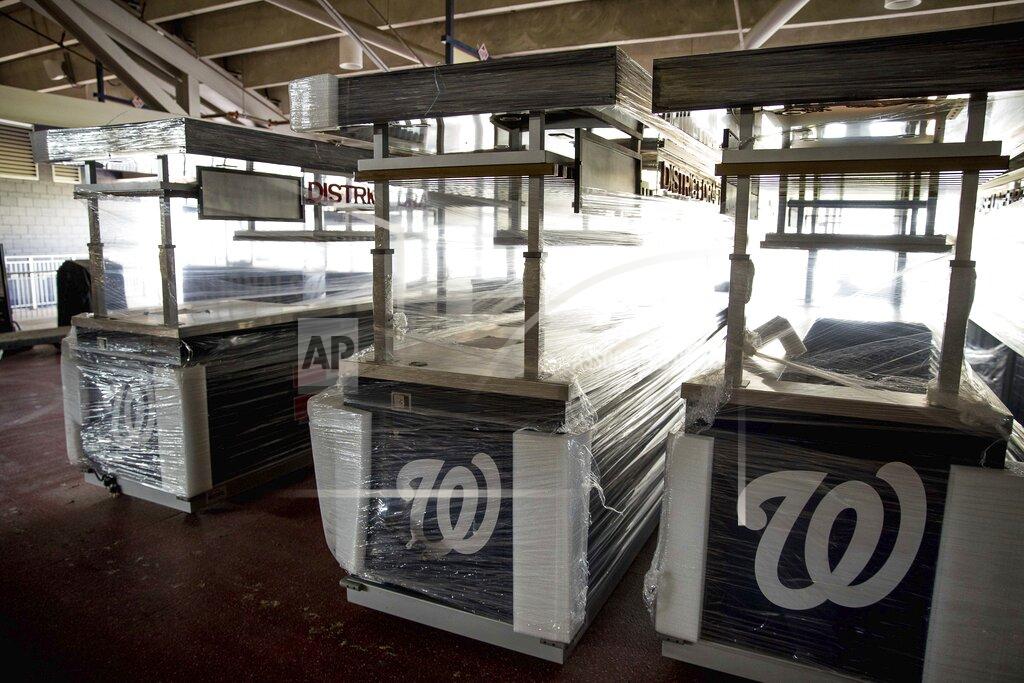 Andrew Harnik Food stalls are covered and empty in the concourse as the Washington Nationals hold their first training camp work out at Nationals Stadium, Friday, July 3, 2020, in Washington. (AP Photo/Andrew Harnik)