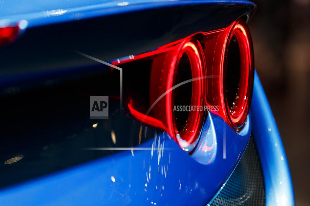 Cyril Zingaro A rear light of the new 'Ferrari F8 Triturbo' is pictured during the press day at the '89th Geneva International Motor Show' in Geneva, Switzerland, Tuesday, March 05, 2019. The 'Geneva International Motor Show' takes place in Switzerland from March 7 until March 17, 2019. Automakers are rolling out new electric and hybrid models at the show as they get ready to meet tougher emissions requirements in Europe - while not forgetting the profitable and popular SUVs and SUV-like crossovers. (Cyril Zingaro/Keystone via AP)