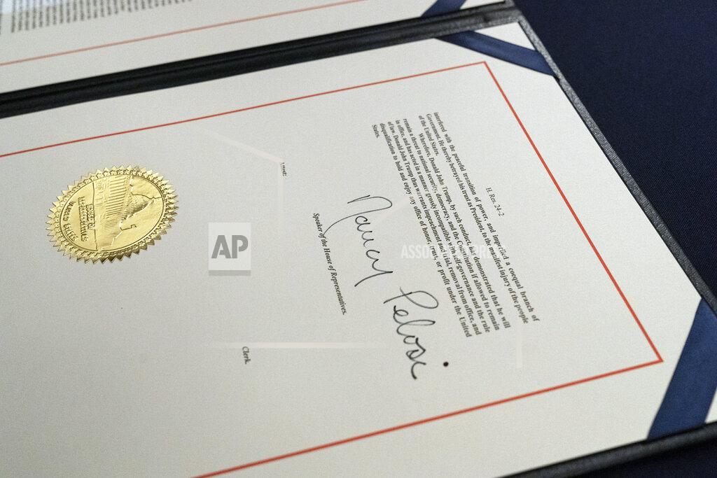 Alex Brandon The signature of House Speaker Nancy Pelosi of Calif., is on the article of impeachment against President Donald Trump, after an engrossment ceremony before transmission to the Senate for trial on Capitol Hill, in Washington, Wednesday, Jan. 13, 2021. (AP Photo/Alex Brandon)