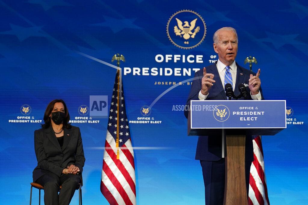 Matt Slocum President-elect Joe Biden speaks about the COVID-19 pandemic during an event at The Queen theater, Thursday, Jan. 14, 2021, in Wilmington, Del., as Vice President-elect Kamala Harris listens. (AP Photo/Matt Slocum)