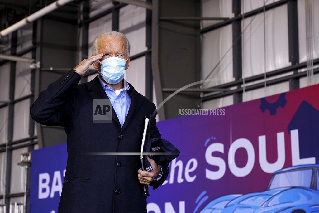 Andrew Harnik Democratic presidential candidate former Vice President Joe Biden salutes after speaking at a rally at Cleveland Burke Lakefront Airport, Monday, Nov. 2, 2020, in Cleveland. (AP Photo/Andrew Harnik)