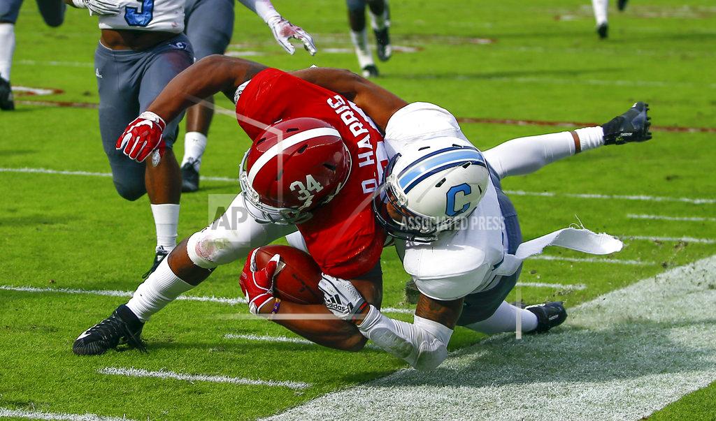 Butch Dill Alabama running back Damien Harris (34) is injured as he is tackled by Citadel defensive back Ronald Peterkin (33) during the second half of an NCAA college football game, Saturday, Nov. 17, 2018, in Tuscaloosa, Ala. (AP Photo/Butch Dill)