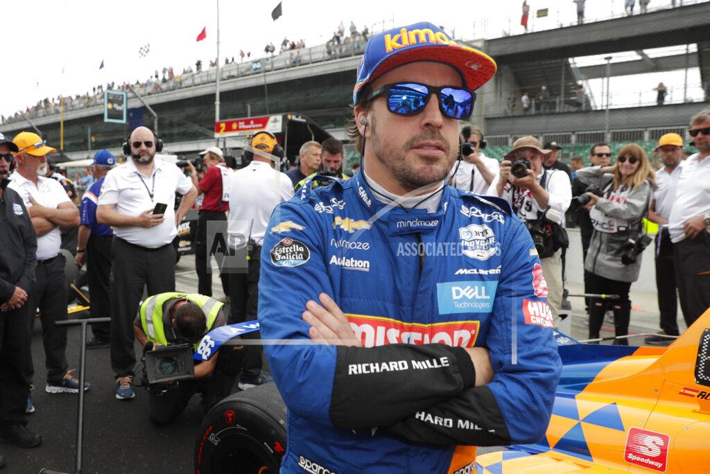 FILE - In this file photo dated Sunday, May 19, 2019, Fernando Alonso, of Spain, prepares to drive during qualifications for the Indianapolis 500 IndyCar auto race at Indianapolis Motor Speedway, in Indianapolis, Ind. Fernando Alonso feels far better about his chances to close out motorsports' version of the Triple Crown in 2020. The Spaniard will race for Arrow McLaren SP in the Indianapolis 500 in May and believes the organization is prepared. (AP Photo/Michael Conroy, File)
