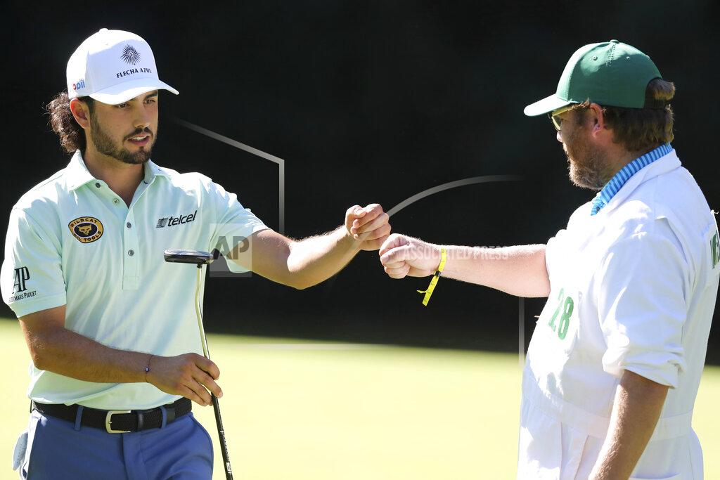 Curtis Compton Abraham Ancer celebrates with his caddie Dale Vallely after Ancer birdied the 6th hole during the second round of the Masters Friday, Nov. 13, 2020, in Augusta, Ga. (Curtis Compton/Atlanta Journal-Constitution via AP)