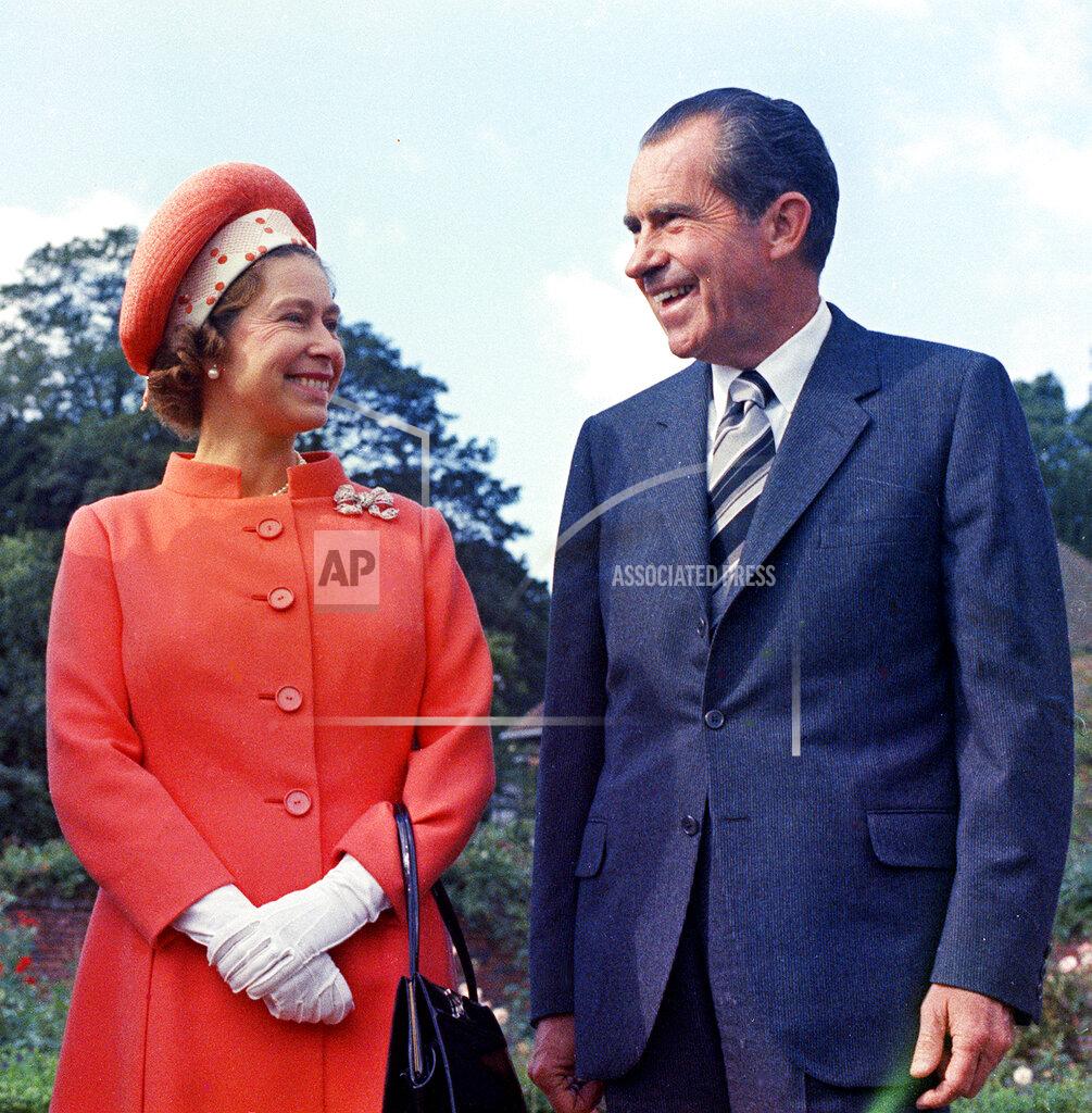 An FILE - In this 1970 file photo, Queen Elizabeth II, left, reacts with U.S. President Richard Nixon, at Chequers, in Buckinghamshire, England. (AP Photo, File)