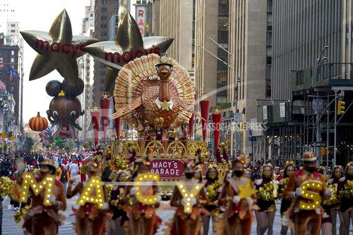 The Tom Turkey float moves down Sixth Avenue during the Macy's Thanksgiving Day Parade in New York, Thursday, Nov. 25, 2021. The parade is returning in full, after being crimped by the coronavirus pandemic last year. (AP Photo/Jeenah Moon)