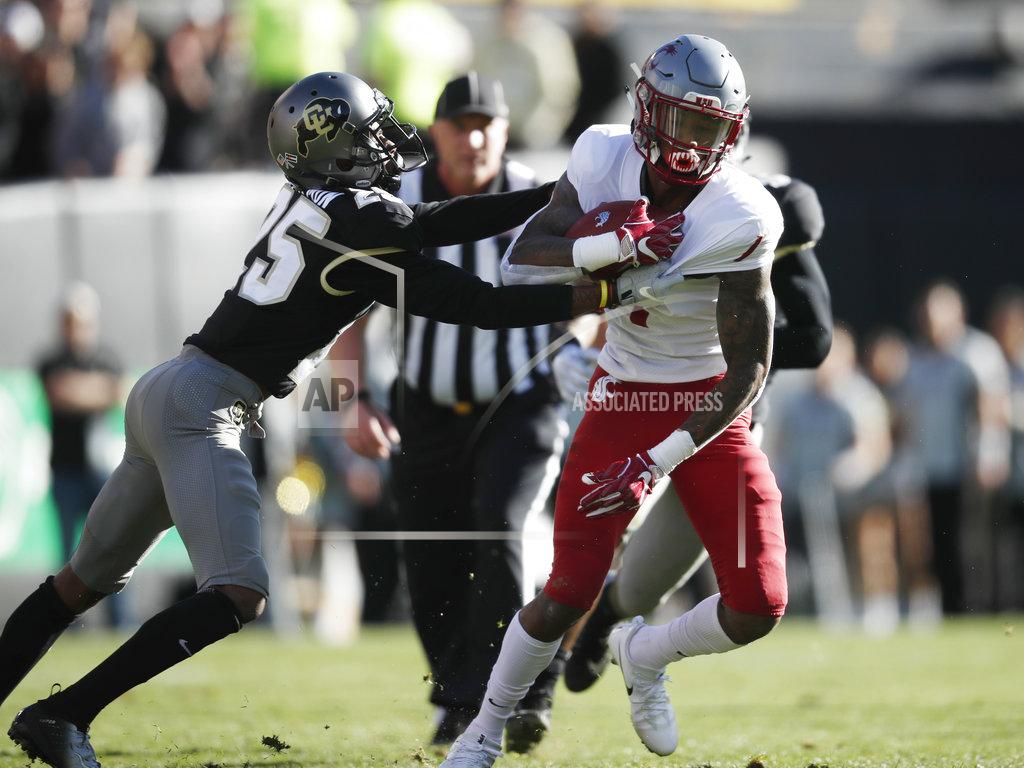 David Zalubowski Colorado cornerback Mekhi Blackmon, left, grabs the jersey of Washington State wide receiver Davontavean Martin as he gains yardage after pulling in a pass in the first half of an NCAA college football game Saturday, Nov. 10, 2018, in Boulder, Colo. (AP Photo/David Zalubowski)