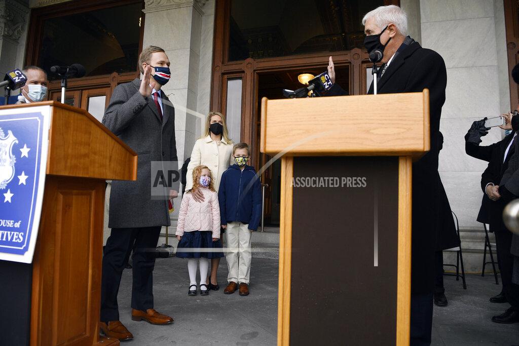 Jessica Hill State Rep. Matt Ritter, D-Hartford, left, is sworn in as Speaker of the House by his father, Thomas D. Ritter, a former House speaker in the 90s, as his family looks on, outside on the State Capitol grounds, Wednesday, Jan. 6, 2021, in Hartford, Conn. The new legislative session is expected to focus on the continuing coronavirus pandemic and the state's budget challenges. (AP Photo/Jessica Hill)