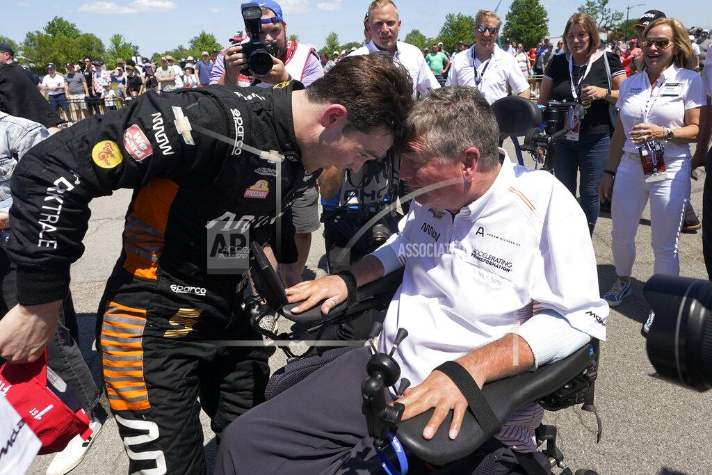 Paul Sancya Pato O'Ward celebrates with a team owner Sam Schmidt after winning the second race of the IndyCar Detroit Grand Prix auto racing doubleheader on Belle Isle in Detroit Sunday, June 13, 2021. (AP Photo/Paul Sancya)