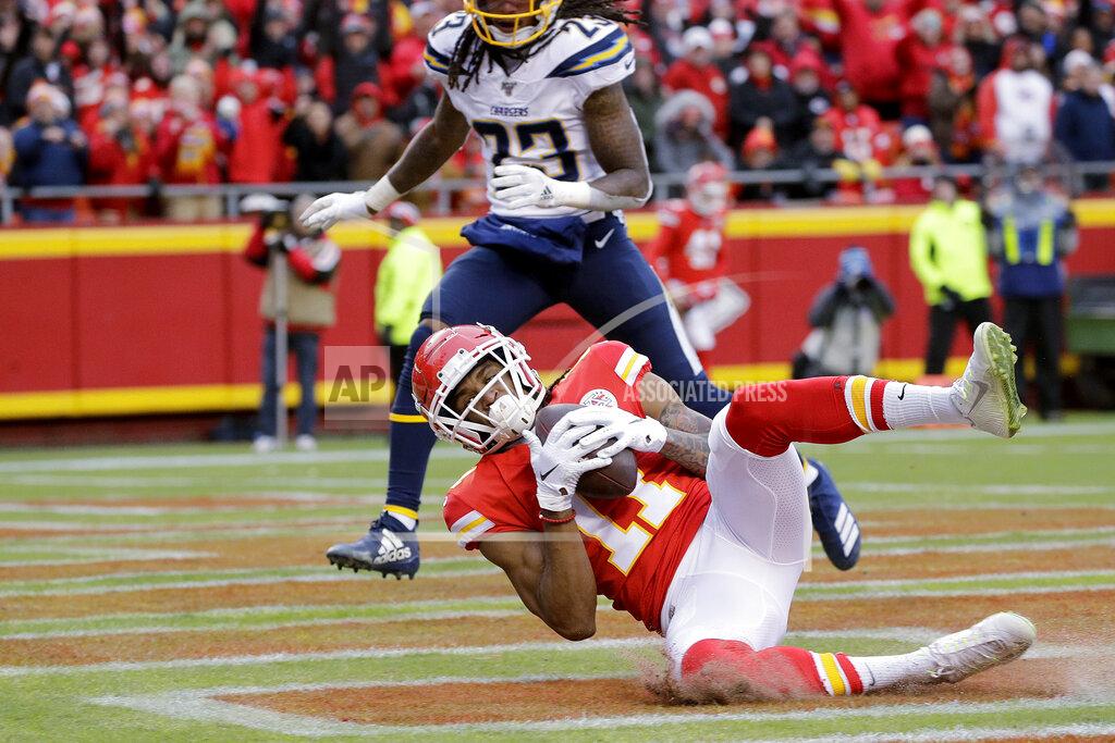 Charlie Riedel Kansas City Chiefs wide receiver Demarcus Robinson (11) makes a touchdown catch in front of Los Angeles Chargers safety Rayshawn Jenkins (23) during the first half of an NFL football game in Kansas City, Mo., Sunday, Dec. 29, 2019. (AP Photo/Charlie Riedel)
