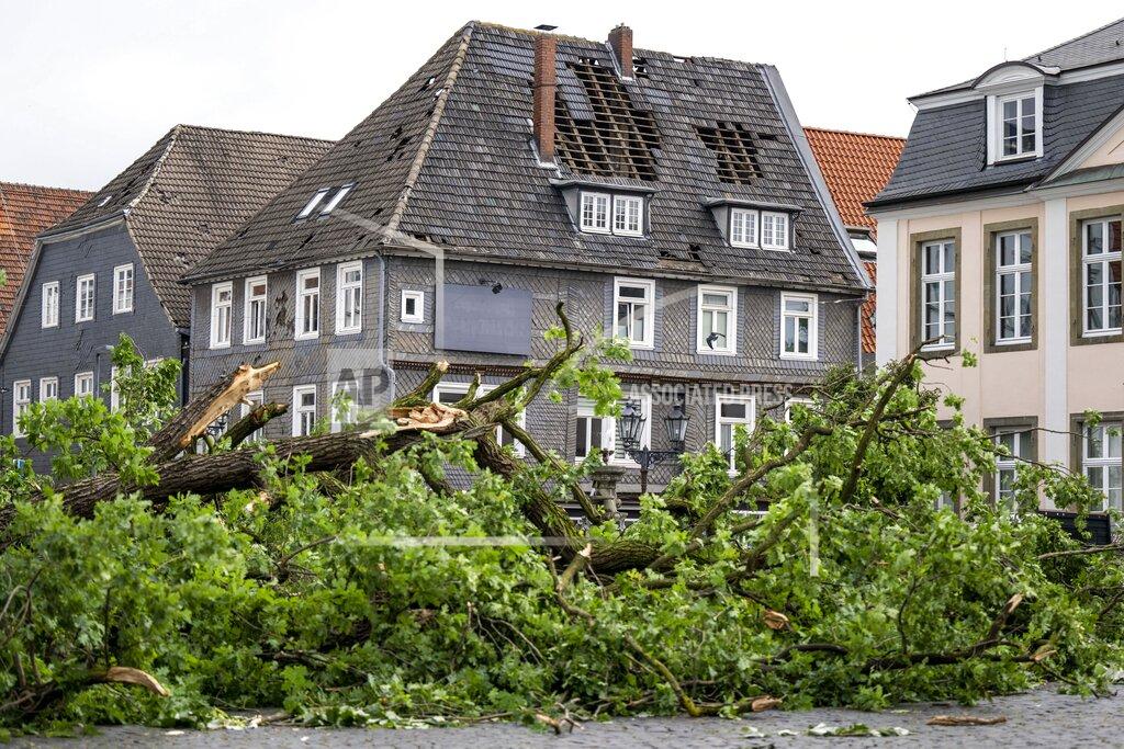 David Inderlied A view of the damaged roof of a residential building in Lippstadt, Germany, a day after heavy rains and storms hit the area, Saturday, May 21, 2022. (David Inderlied/dpa via AP)