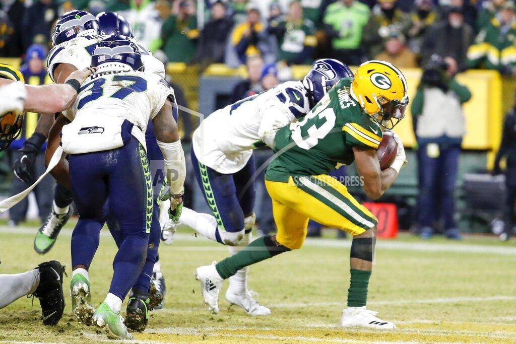 Matt Ludtke Green Bay Packers' Aaron Jones runs for a touchdown during the first half of an NFL divisional playoff football game against the Seattle Seahawks Sunday, Jan. 12, 2020, in Green Bay, Wis. (AP Photo/Matt Ludtke)