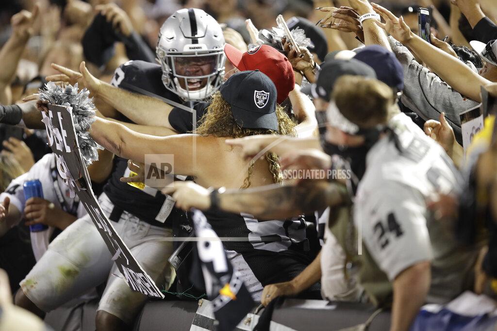 Ben Margot Fans in The Black Hole reach out to mob Oakland Raiders running back Josh Jacobs after he scored a touchdown during the fourth quarter of an NFL football game against the Denver Broncos Monday, Sept. 9, 2019, in Oakland, Calif. (AP Photo/Ben Margot)